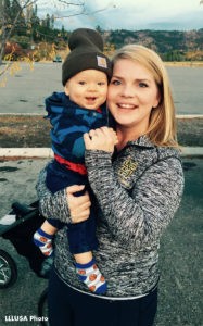 Victoria, in running gear, with her son