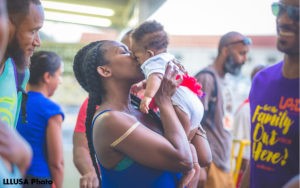 Danielle kissing her daughter Geneva