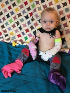 Kendra's daughter dressed herself with socks and gloves