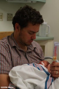 Ben feeding his daughter pumped milk through a nasogastric (ng) tube