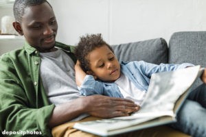 Father reading to his son