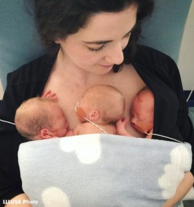 Annwyl with her 3 boys skin to skin