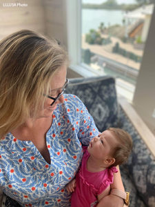 Grace looking at her baby