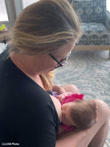 Grace breastfeeding her baby