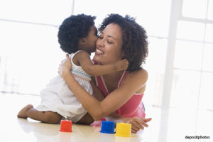 Mother embracing her toddler