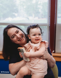mother holding her baby at LLL meeting