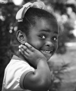 Child looking in camera, surprised 