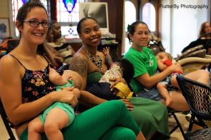 Moms nursing their babies at a LLL meeting