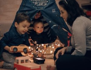 Mom with her boys playing indoor in tent / fort