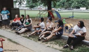 Mothers nursing at a breastfeeding meeting outside