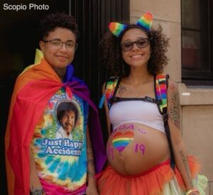 Pregnant person celebrating Pride month 
